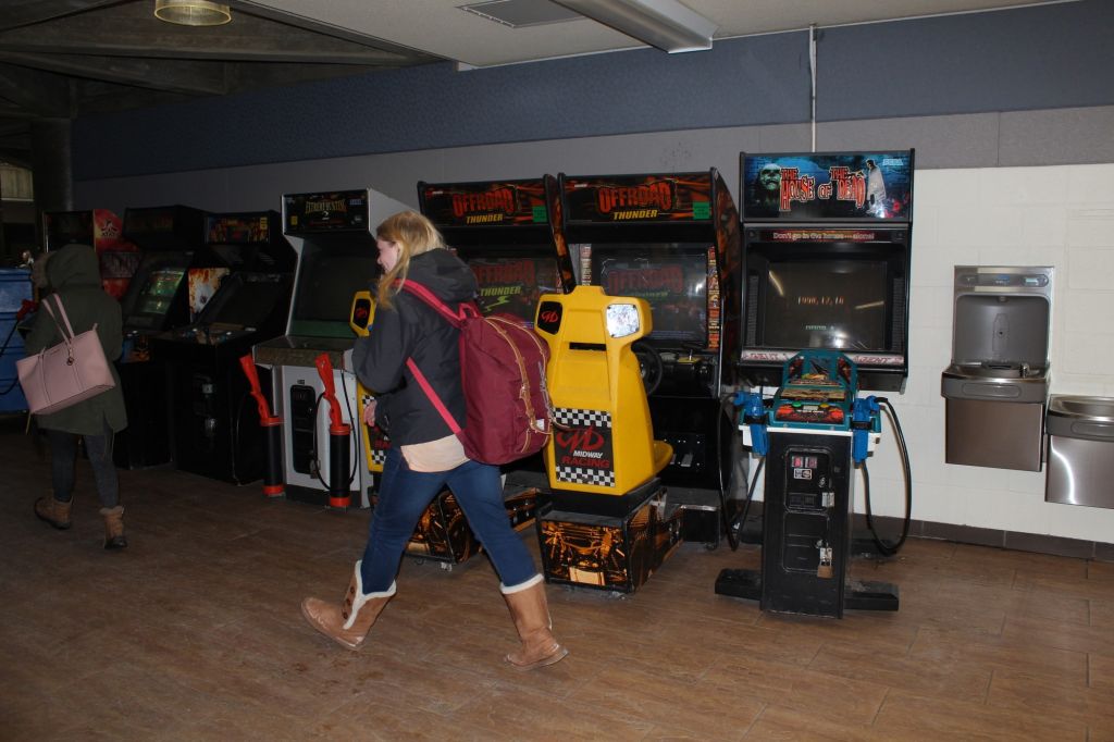 Arcade machines in B-building. People walk by yet very few of them pay attention to these machines.