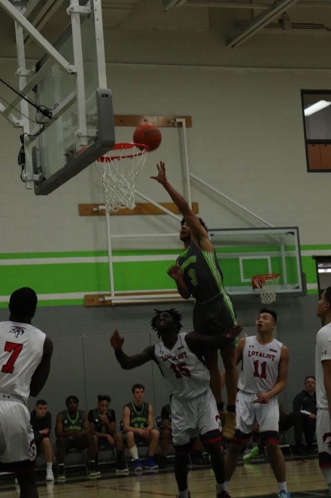 Daoud (Dawwd) Soukary jumping scoring a basket against Loyalist. The Thunder was defeated by the Lancers.