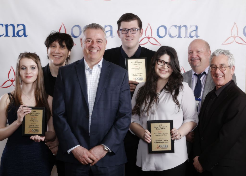 Ontario Community Newspapers Association president John Willems, middle, is surrounding by advertising and journalisms students and faculty. From left, journalism student and former Times managing editor Iliyana Shoushounova, advertising student Sam Sellon, former Times editor Trevor Oattes, and advertising student Candy Wasserman. At right are journalism coordinator/professor Joe Banks and advertising professor Jake Volt. The group attended the association's annual convention in Vaughan, Ontario, to receive the awards.