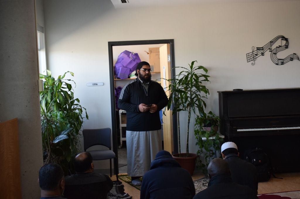Student Ibrar-ul Haq leading the Friday prayer in the Spiritual Centre. Haq has stated that the Muslim community has increased vigilance following the Christchurch attack.