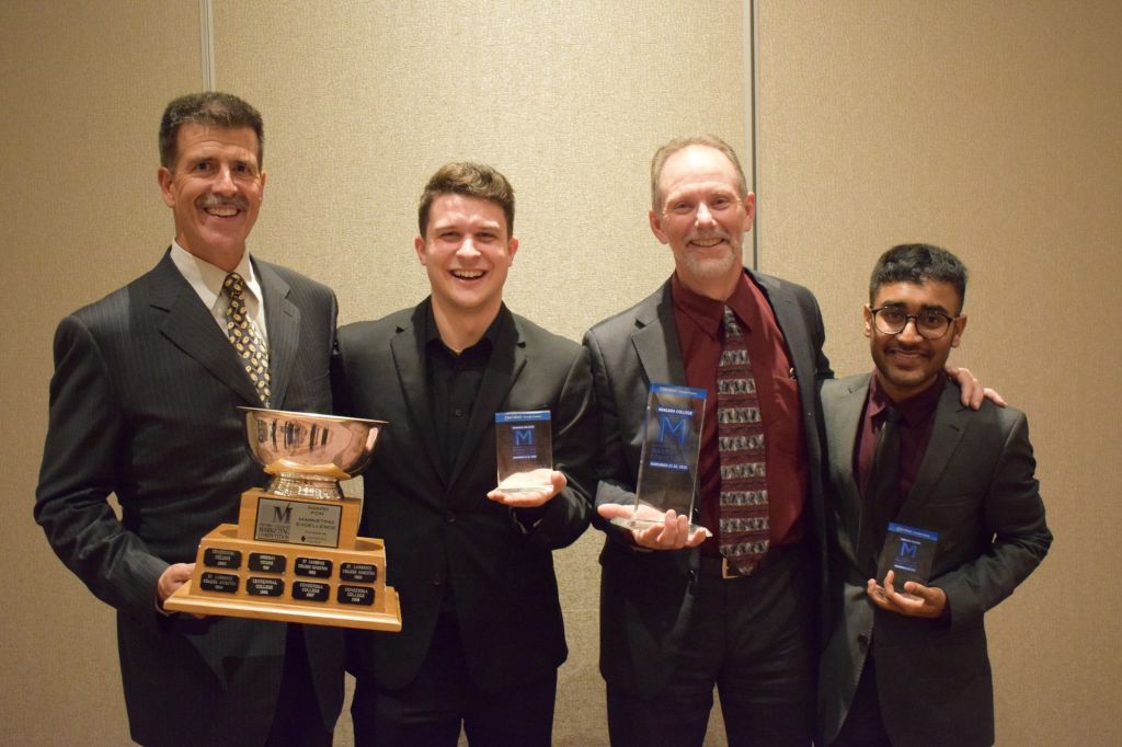 Bill Garbarino and Jim Neubauer with the entrepreneurship team with their trophies.  Ethan Kirkpatrick and Pushpvir Singh represented Algonquin College in the entrepreneurship category.