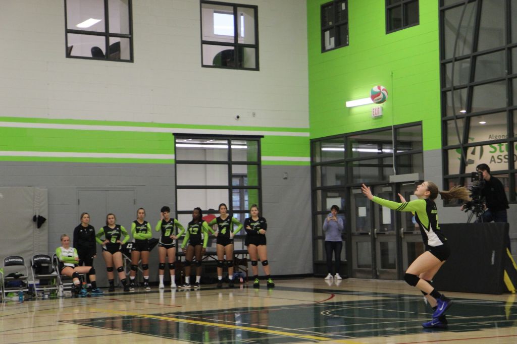 Emily Porter serving the ball at the volleyball game at Algonquin College on Nov. 2.