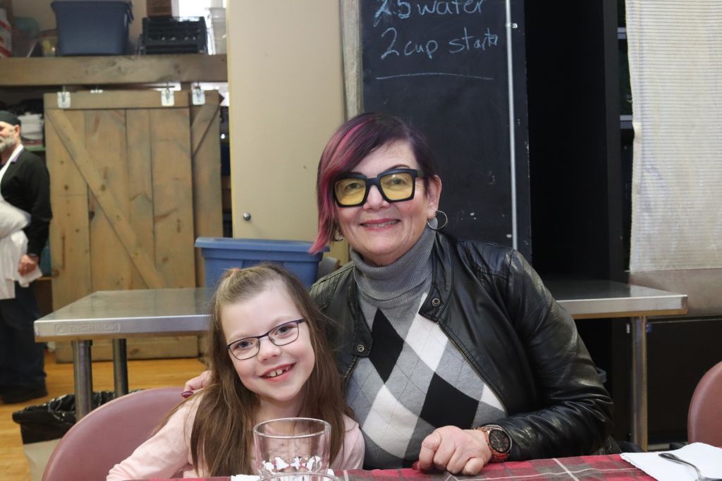 Nailah Pawsen, 7 and Executive director of the Parkdale Community Kitchen, Karen Secord, 60.