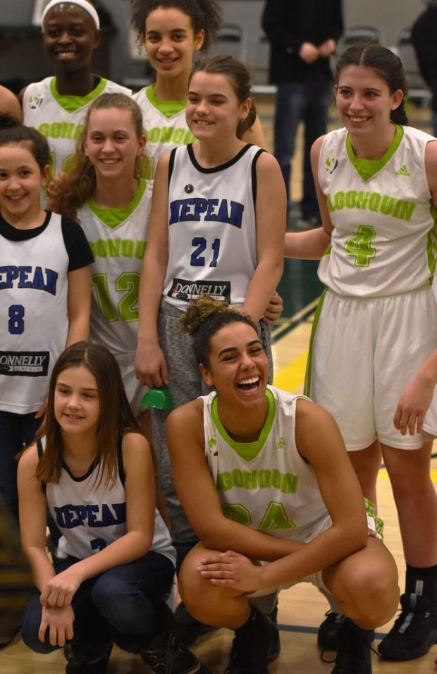 Rita Sibo, Meaghan McNamara, Nyla Sabourin, Alyx Caesar and Michaela Branker joined a young girls basketball team from Nepean that were there to cheer them on at the seniors’ game on Fri. Feb. 21.