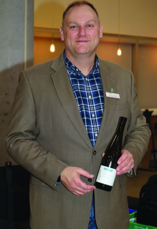 Gregory Nyman, sommelier instructor at Algonquin College, showcases a bottle offered in the pairing event.