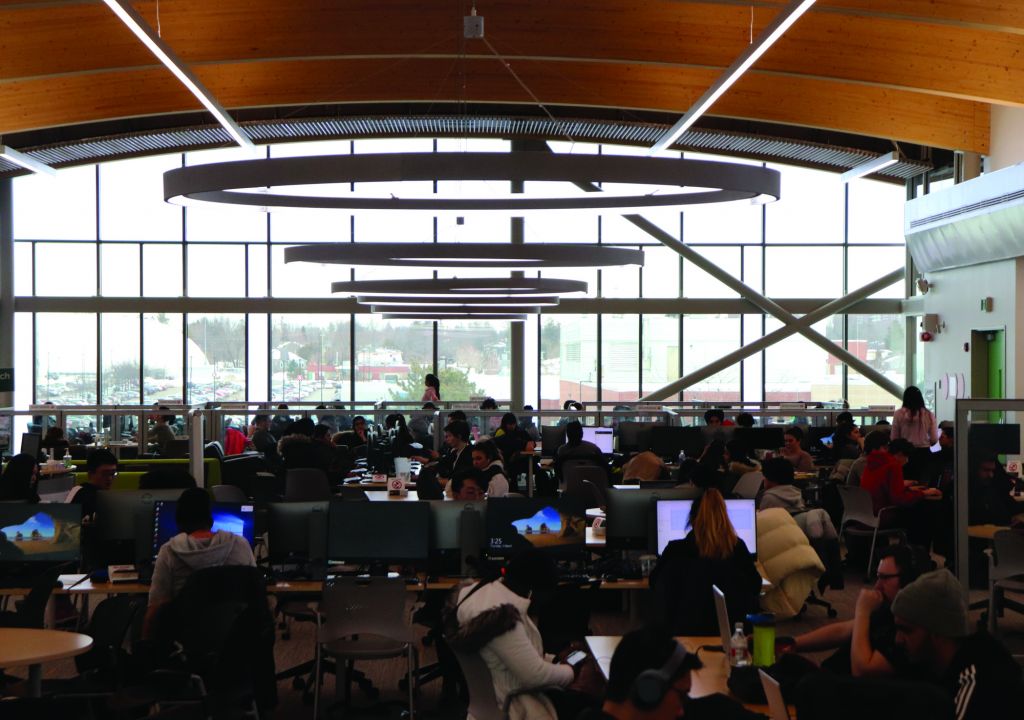 Students work away in the campus library in early March.