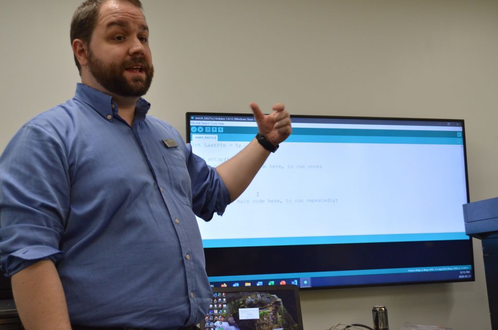 Stephen Gagne, the coordinator of the event, explains what the Arduino device can do. Attendees were invited to create something incredible with the device if they put their imagination to the test.
