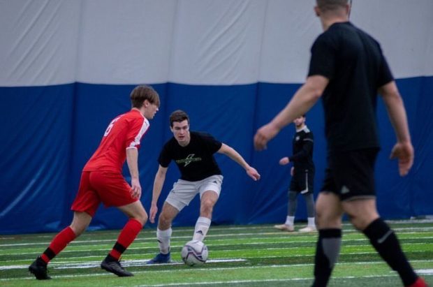 Nicolas Bisaillon, center, training in an indoor soccer dome