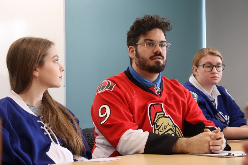 Jeff Hay and public relations students, Michelle Allin and Haley Long, during a press conference on March 12, 2020.