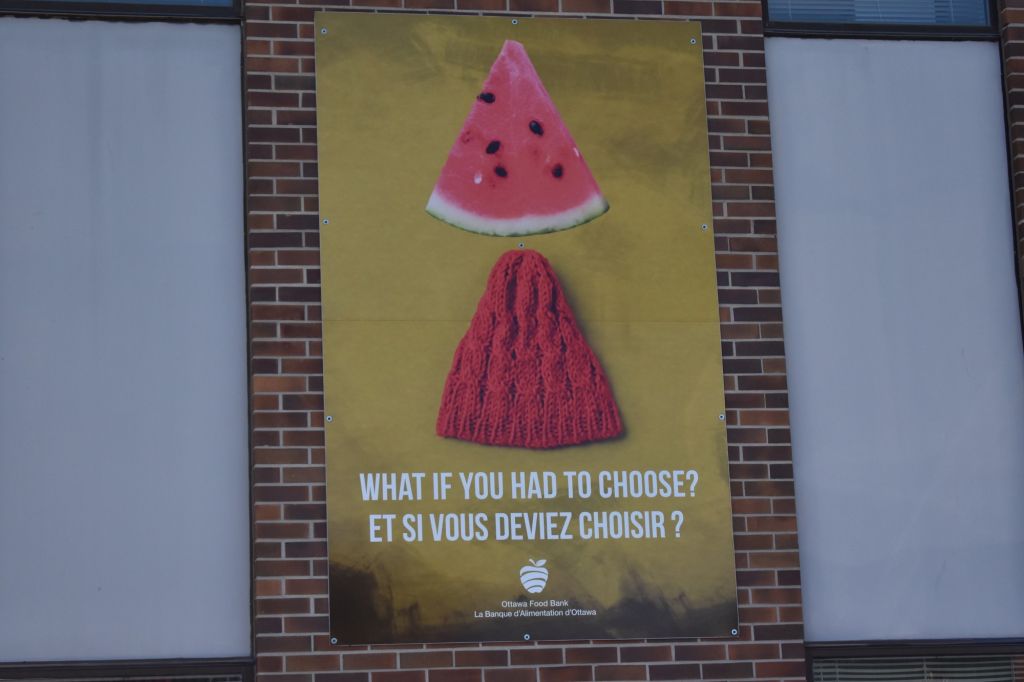 A sign posted outside the Ottawa Food Bank poses the question