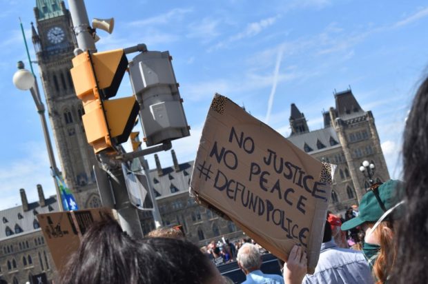 A sign calls the defunding of police