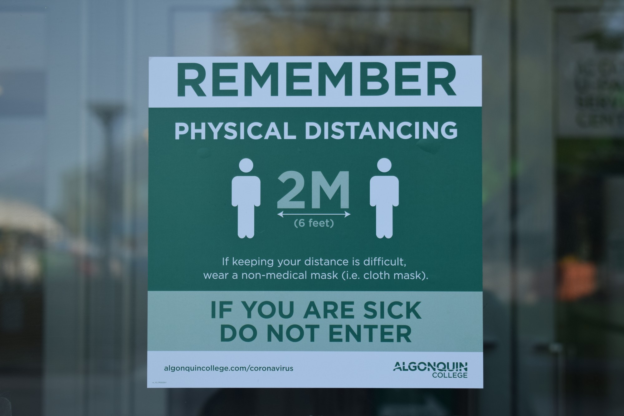 Signs around campus encourage students to practice physical distancing and to stay home when feeling sick