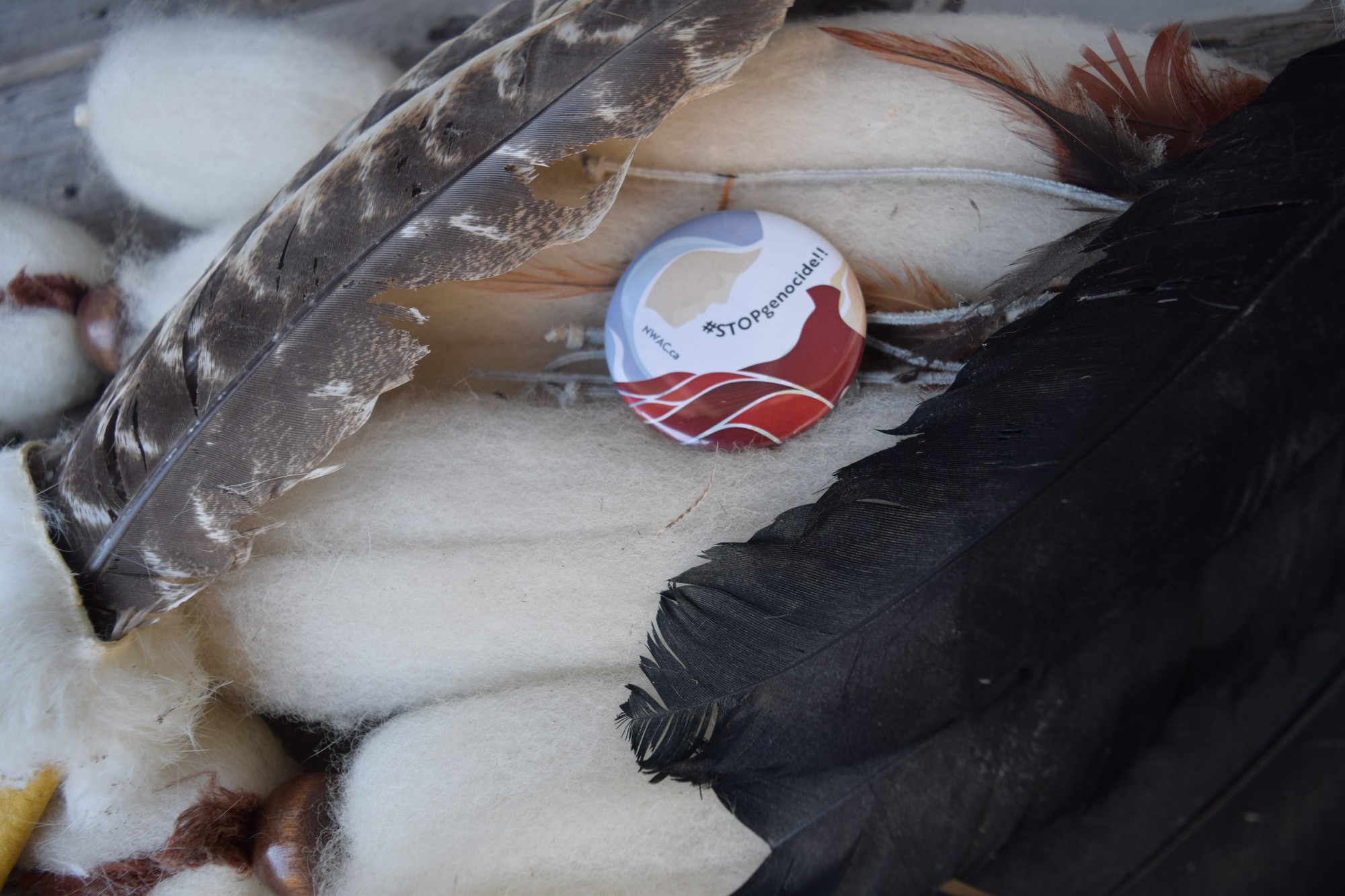 A National Women's Association of Canada pin promotes conversation and support of the Missing and Murdered Indigenous Women and Children movement.
