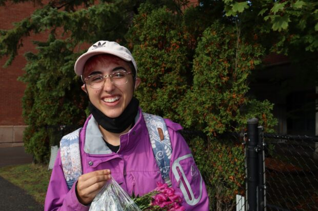 Taylor Haugh, a horticultural industries student was all smiles as she walked on campus with a bag full of flowers.