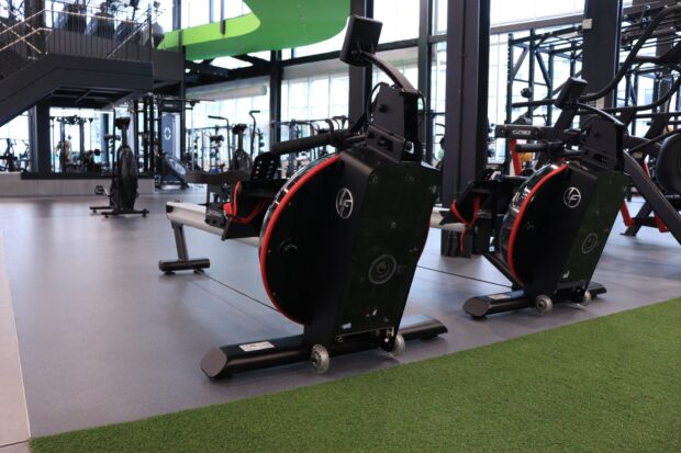 Rows upon rows of equipment such as elliptical machines that are provided by Hammer Strength and Life Fitness.