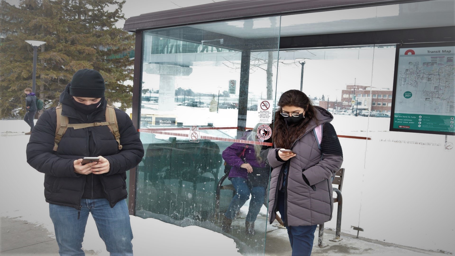 Nicolas Touma, a first-year engineering technician student at Algonquin College waiting for his bus to go home alongside Aashima Gulati, a University of Ottawa student