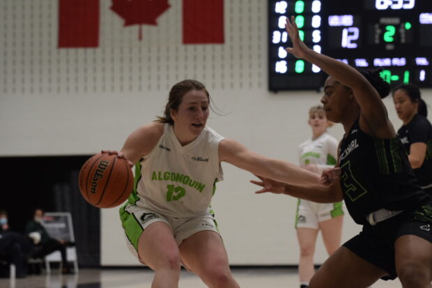 Jennica Klassen guards the ball from the Colts defender, Christianna Crooks