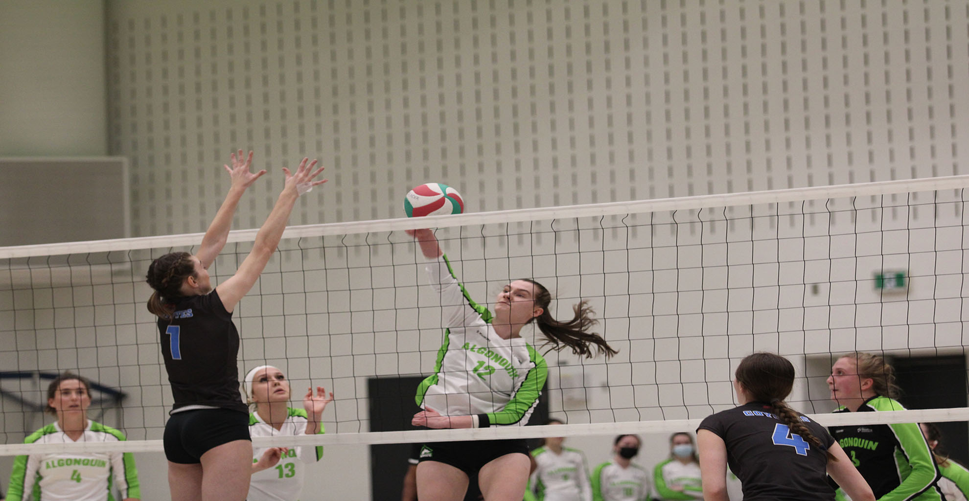 Erin Cunningham attempts a spike against the La Cite Coyotes