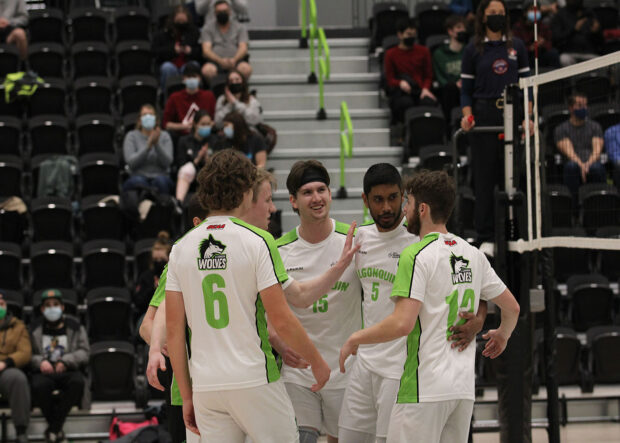 Wolves celebrate after winning a point against the Centennial Colts.