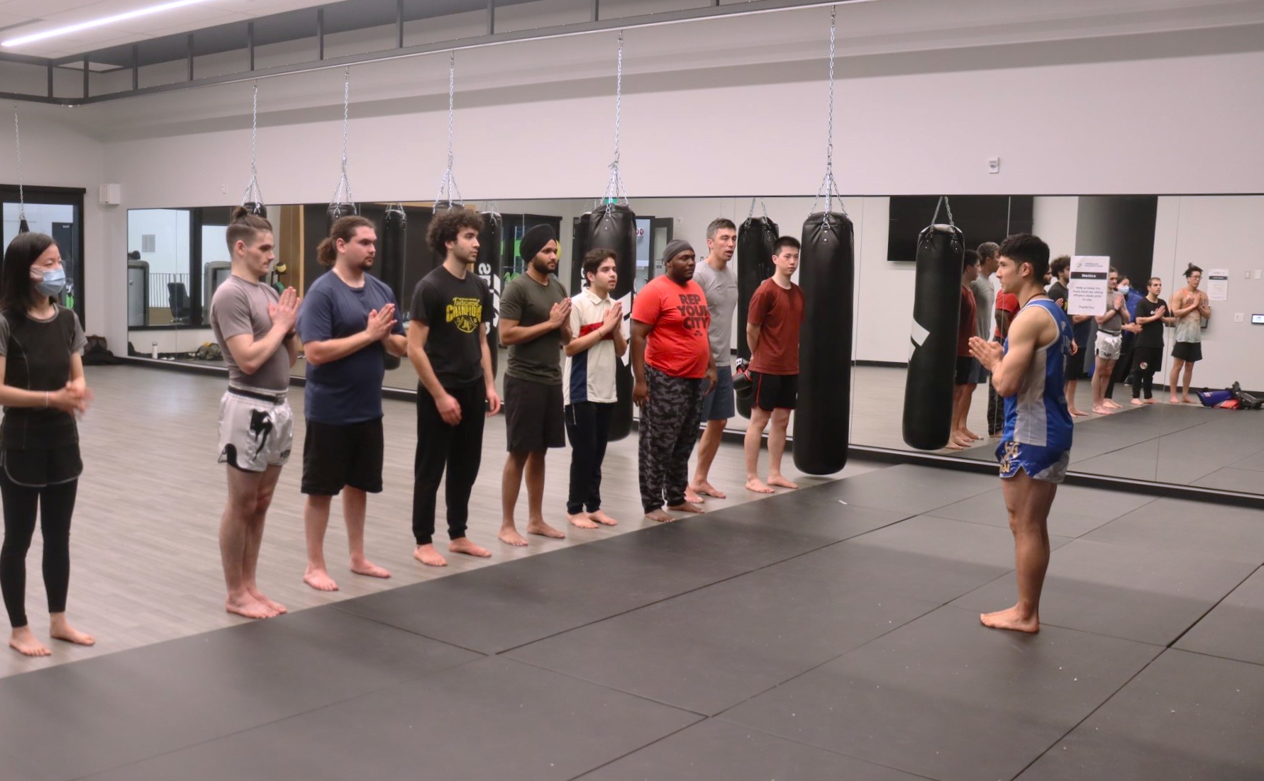 At the end of a class, Muay Thai students pay their respect to their teacher.