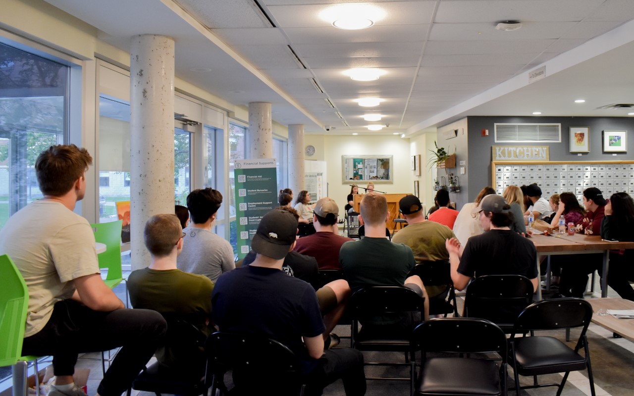 Twenty-two students gathered in the back lobby of the residence building for Open Mic night on June 10.