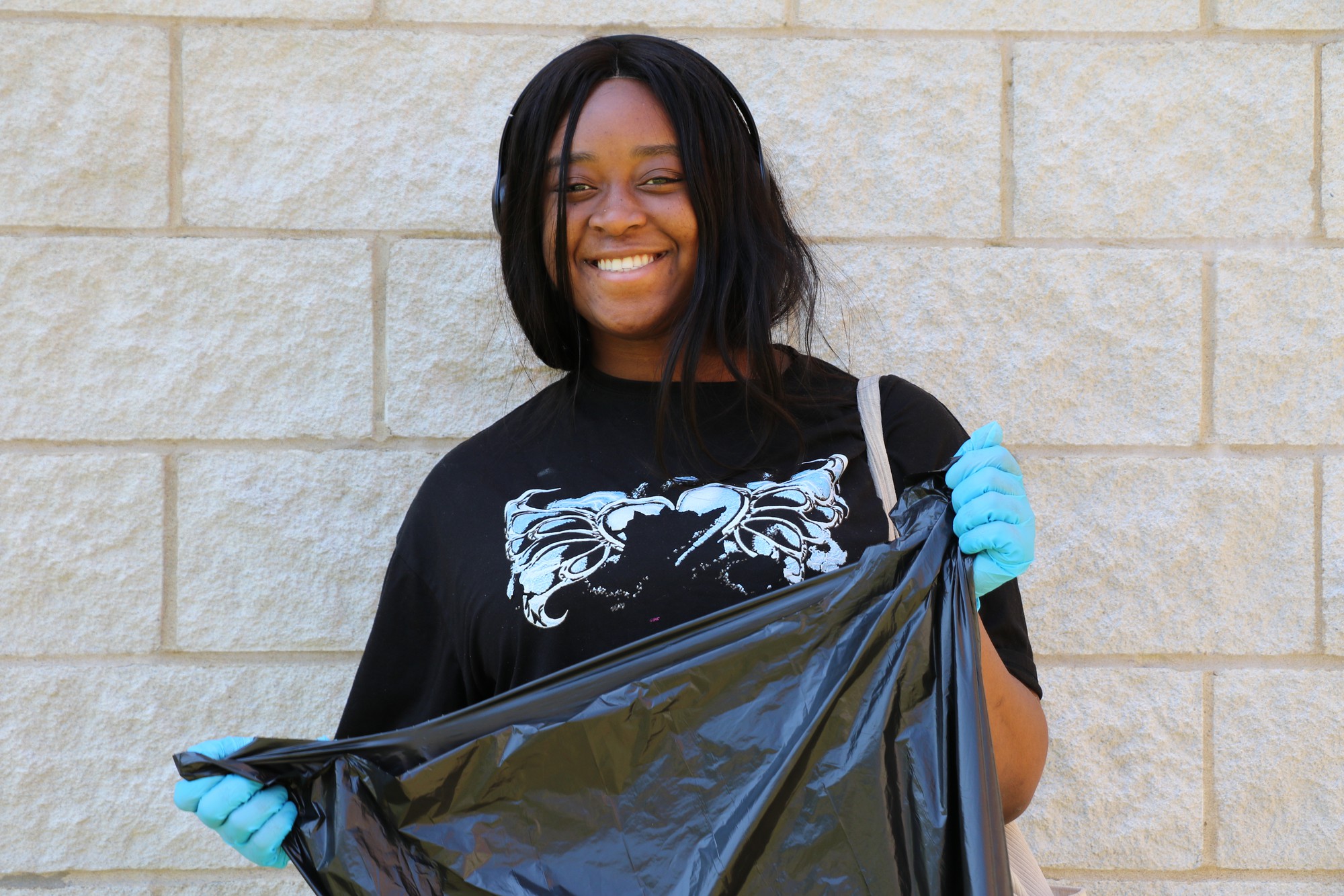 Ifeoluwa Olubode, culinary management student and residence occupant, volunteering with Campus Clean-up in July
