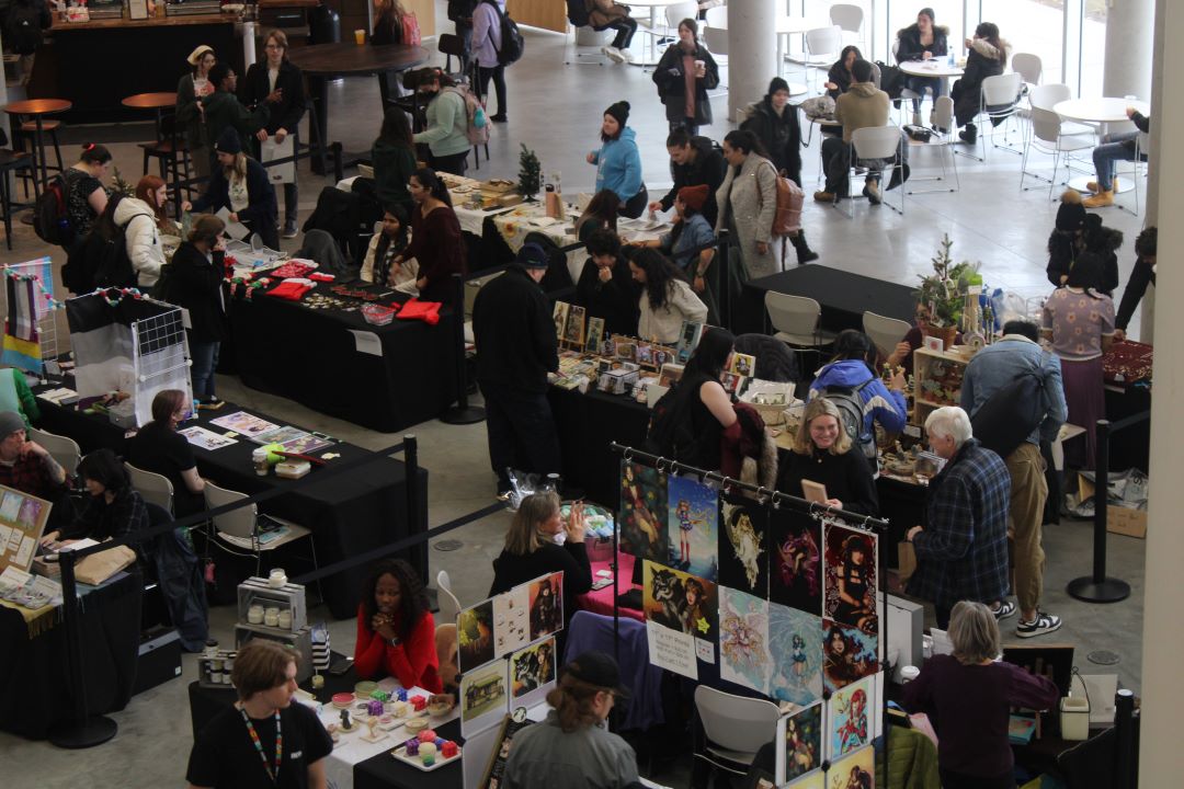 A crowded Students Commons celebrating the first-ever Holiday Craft Fair at Algonquin College.