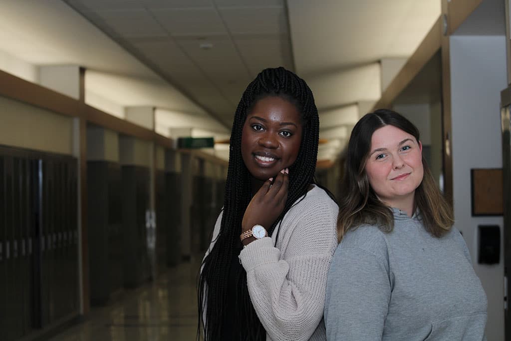 Noëlla Kondo (left) and Aleda Waddigton, first-year bachelor of digital marketing communication students.