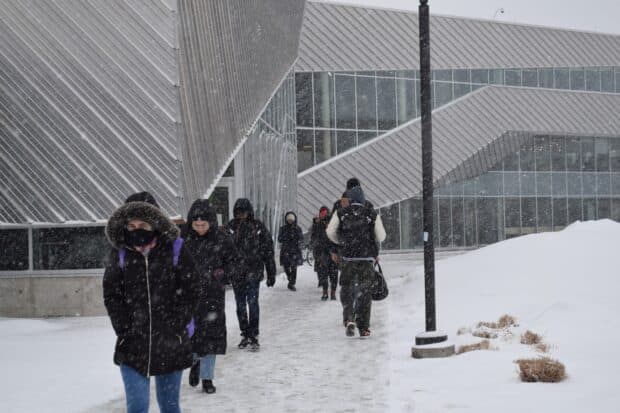 Students try not to freeze on their way toward the N-building on Jan. 12.