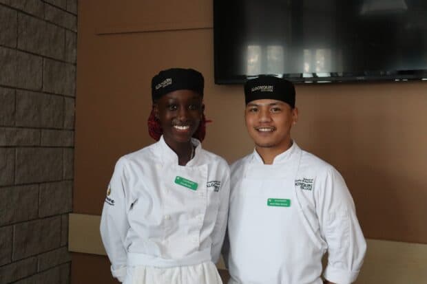 Algonquin College culinary students Gina (left) and Jmark (right) provided omelettes in the breakfast buffet, and talked about their feelings about the event.