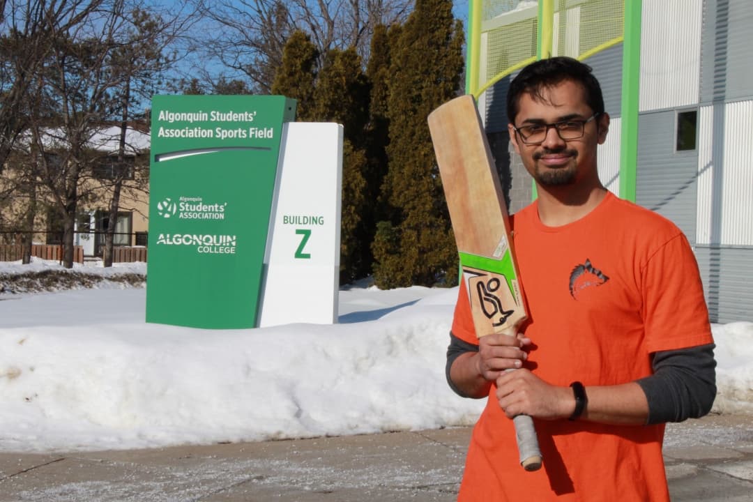 Joseph Alappat stands outside of the Z-building before a cricket match on Wednesday.