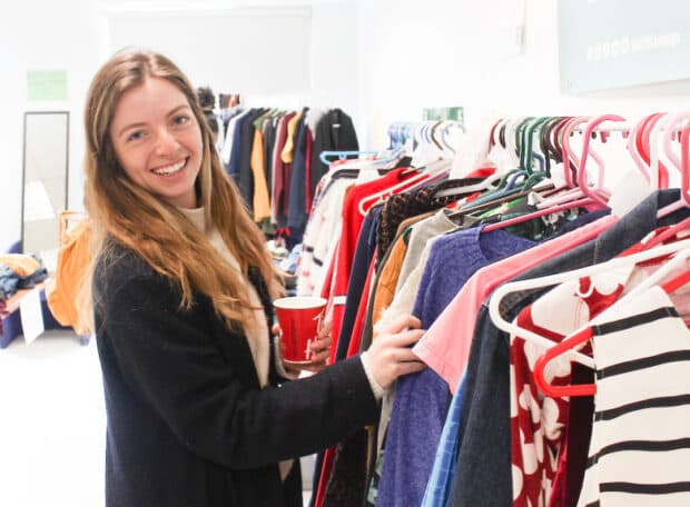 Renée Jewer-Pineau looks for her newest shirt to add to her closet.