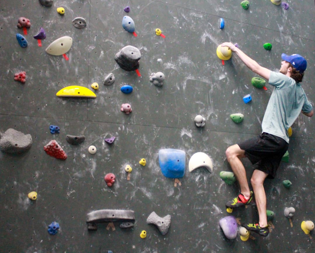 Greg Heibet on the bouldering wall during the five-day climbing competition.