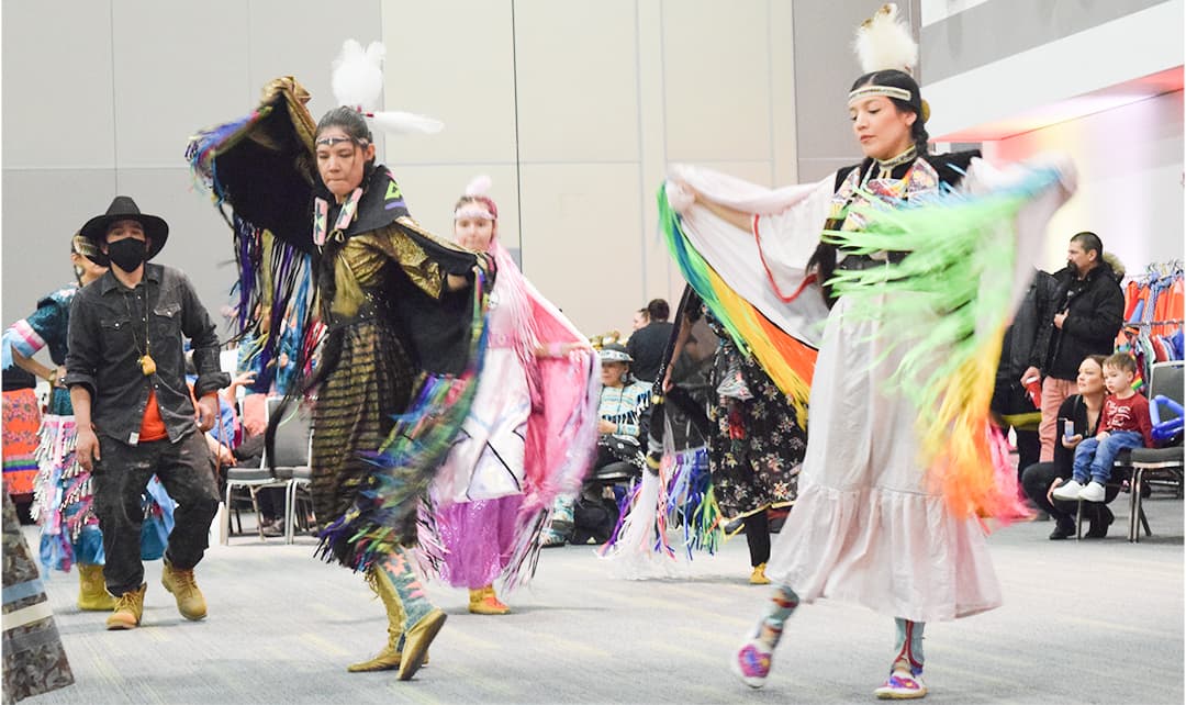 Dancers performed the grass dance during the powwow at the Shaw Center on March 25.