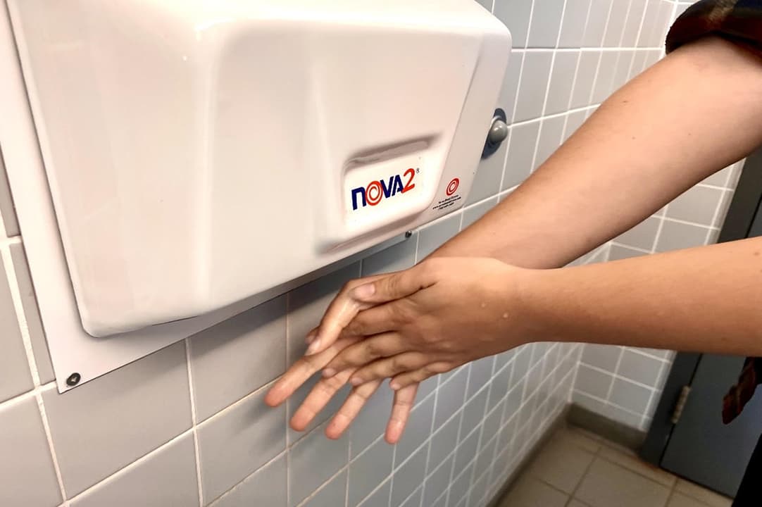 Students risk being late for class while taking the time to blow dry their hands. On some machines, it can take more than a minute and a half to get to dry digits.