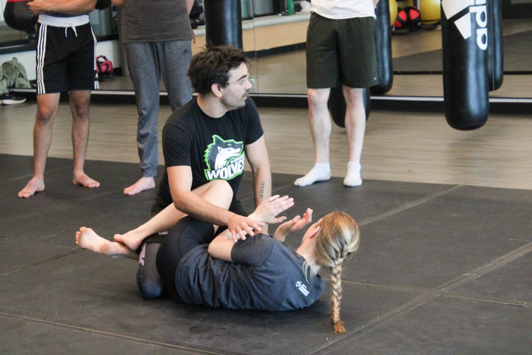Keith Micomonaco (top) shows a class a jiu-jitsu technique with Lindsey Walsh at the Jack Doyle Athletics and Recreation Centre.