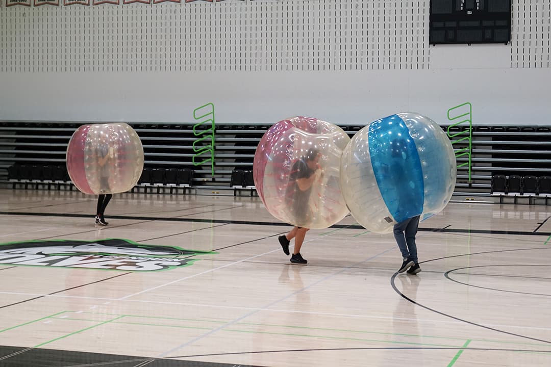 Two students clash during a game of bubble soccer at the Varsity Gym on Oct. 11.