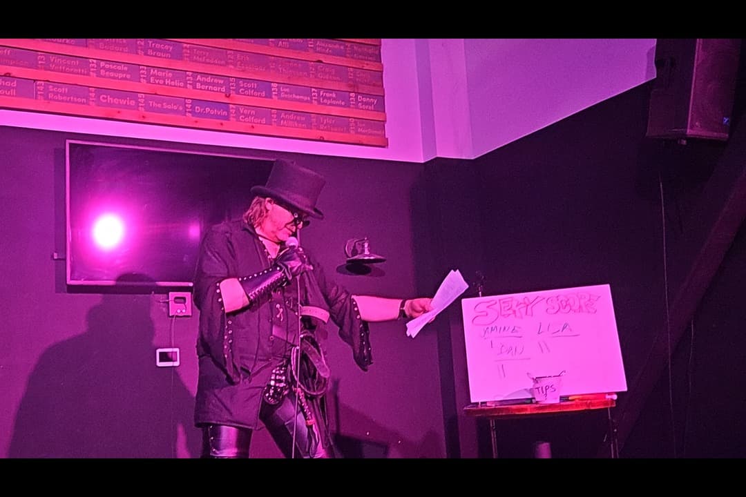 Emerson Lake reads dirty song lyrics for the crowd at Stray Dog Brewing Company in Orleans on Oct. 20.