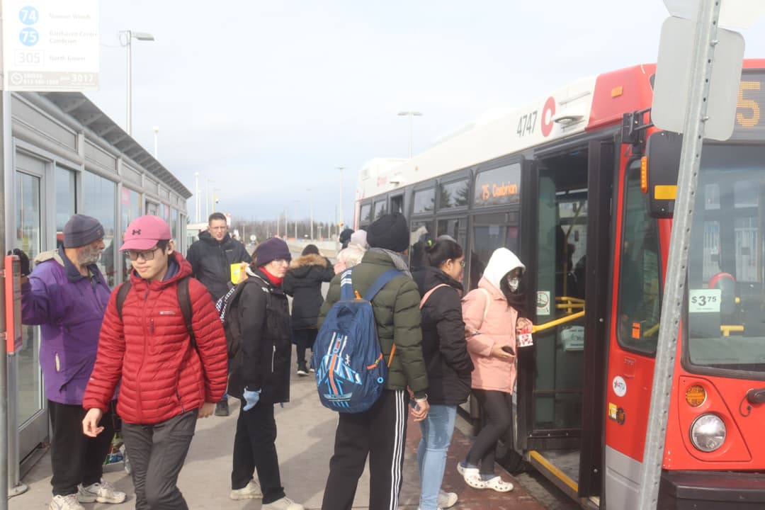 Students board the 75 Cambrian at Baseline Station on Nov. 15.