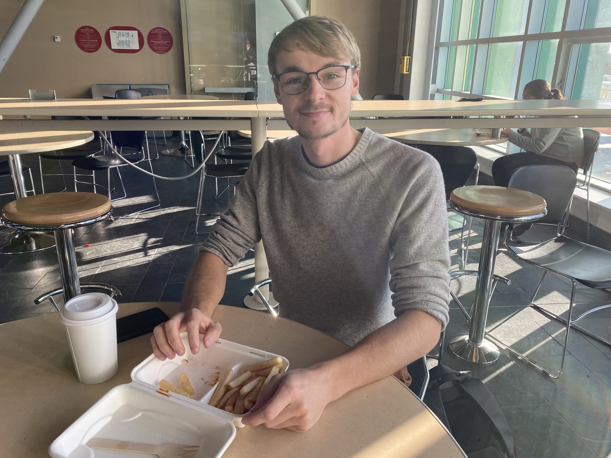 Algonquin College student, Aidan Wilkens, eats lunch at the ACCE cafeteria.