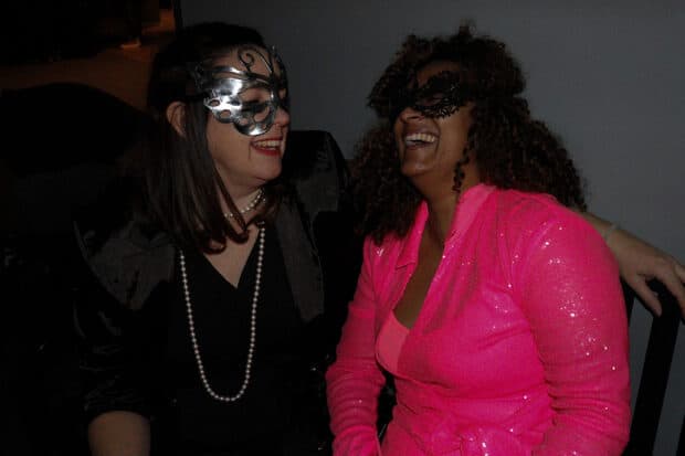 Algonquin College professor Kim Bosch, right, and friend Stephanie Marhue, left, enjoying the 4Wheelies masquerade ball event.