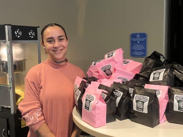 On top of a free screening, Algonquin College students were treated to free popcorn for the movie. Pictured: Veronica Sanchez, events assistant coordinator