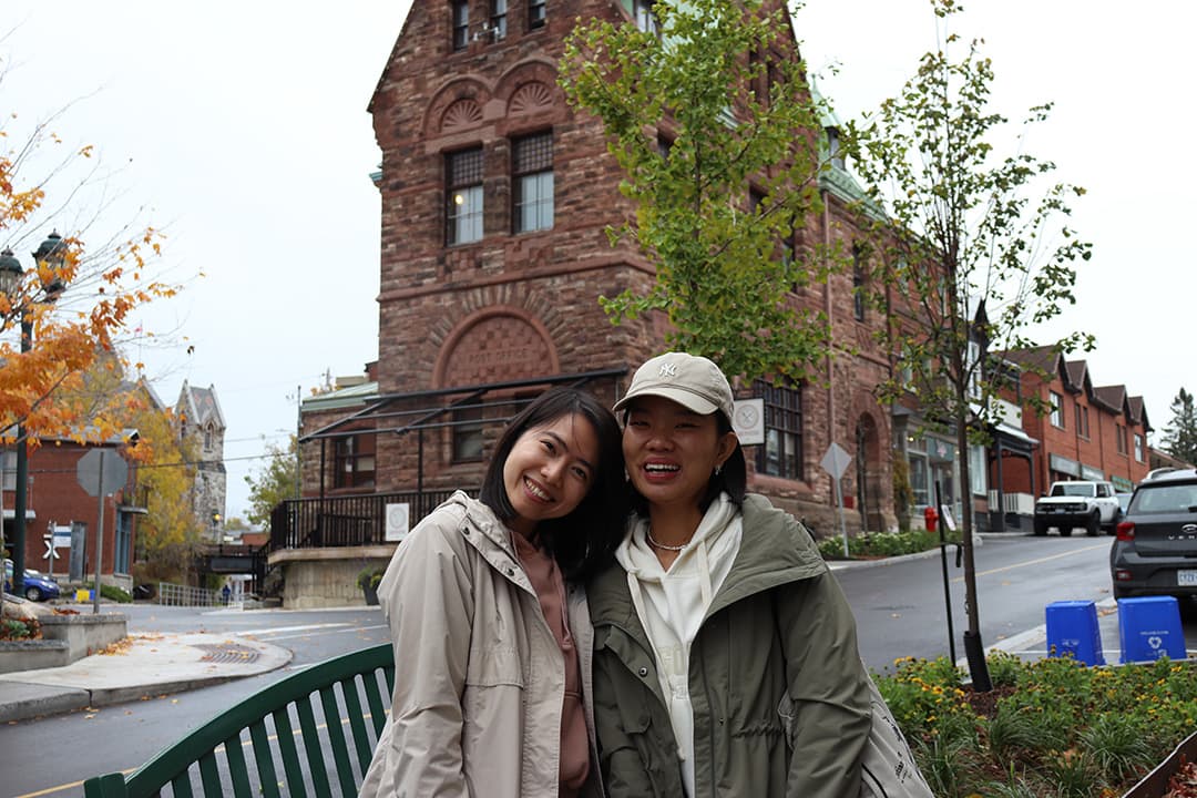 Trang Nguyen (left) and Melissa Yang (right) stand in front of the former Almonte post office converted into a restaurant.
