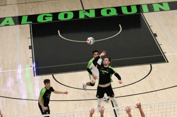 Jeff Commerford spikes the ball for a point late in the first set.
