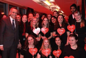 Mayor Mark Sutcliffe posing with Health Sciences Program Coordinator Karen Tran and students in the Cardiovascular Technology and Diagnostic Cardiac Sonography program in the ARC bridge