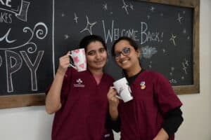 Disha Purohit and Pinky Kumari posing with their finished mugs.