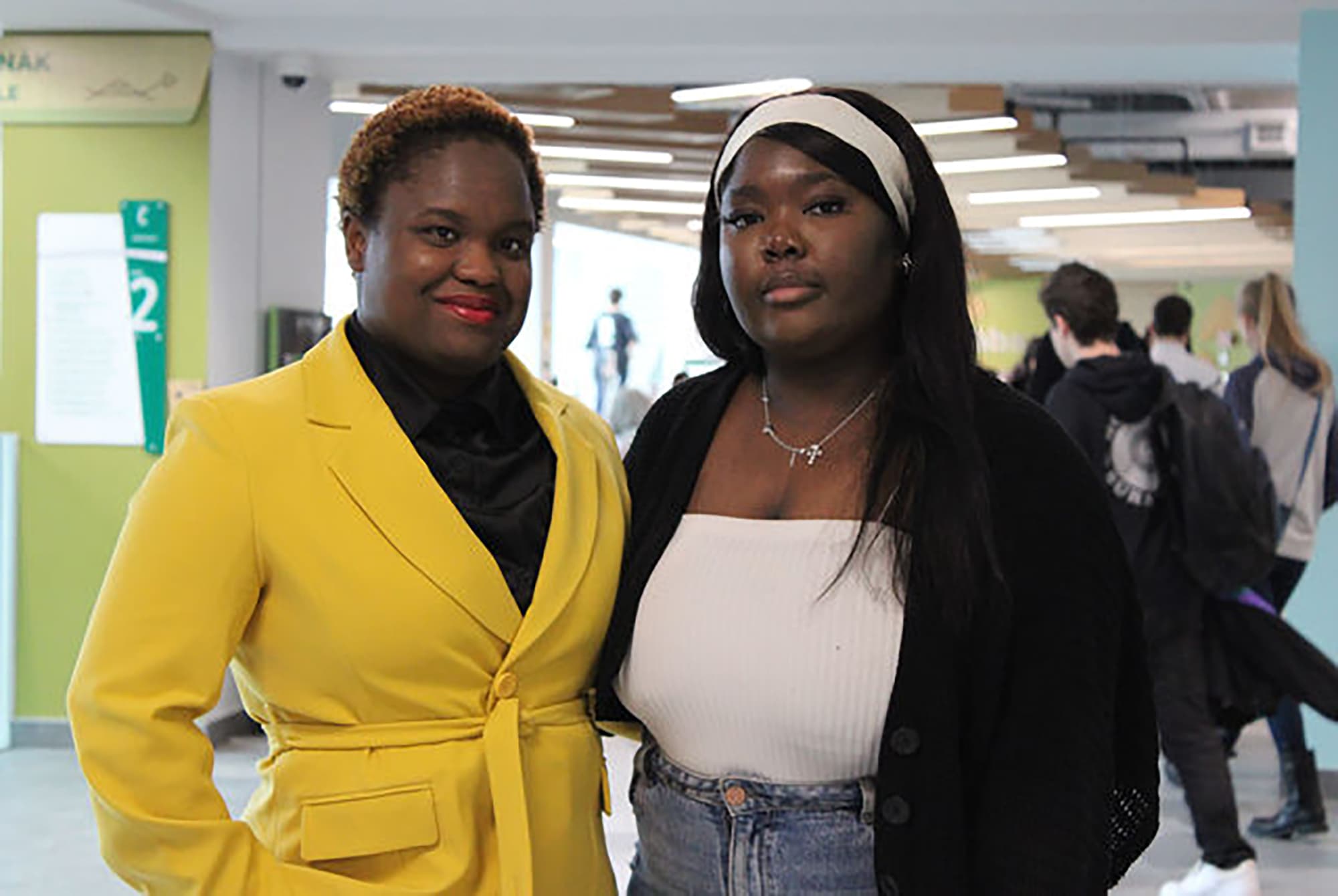 Emmanuela Nazaire, left, and Verah-Ninia Lucien, right, pose in C-building at Algonquin College's Ottawa campus.