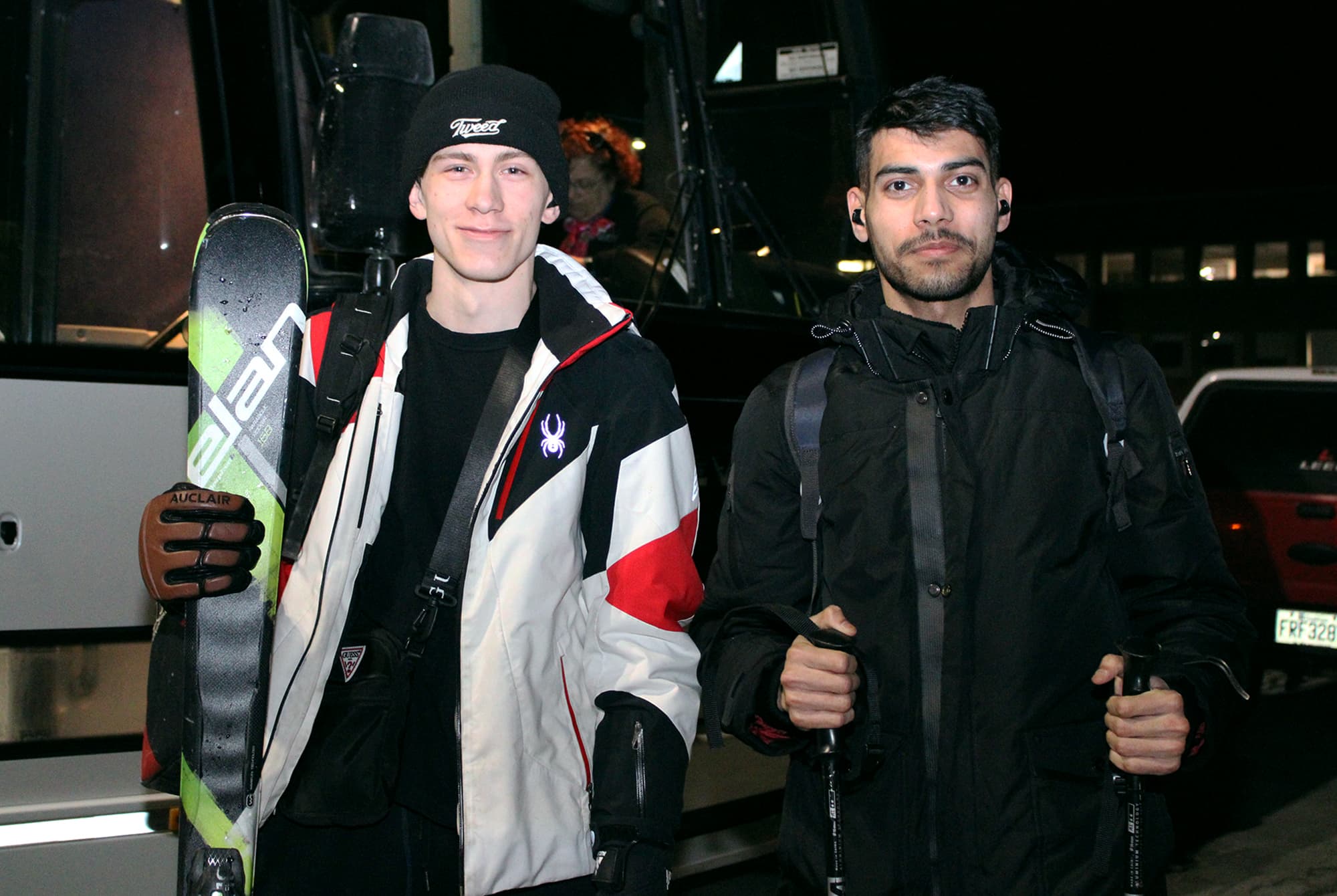 Cristiano Venucci (left) and Vivek Jaswal (right) stand in front of the bus after returning from a ski trip to Mont-Tremblant on Feb. 25.