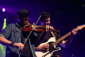 Tyler Vollrath (left) and Xavier Leahy showcase their fiddling and guitar skills for the crowd