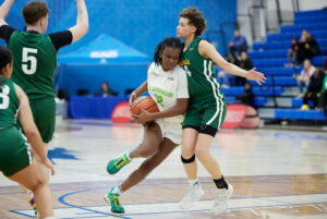 Wolves guard Cianah Miller playing offence at the semi-final game against